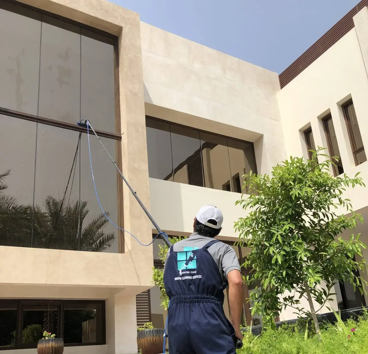 Crystal Clear reach-and-clean window washing at a villa