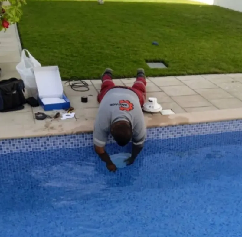 Engage technician repairing a pool light